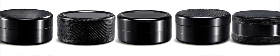 Hockey pucks set close up, various angles, texture and lighting, black rubber, professional sport gear, winter game. Isolated on white or transparent background