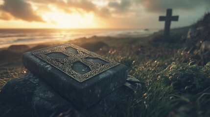 An ornate stone book rests on grass near a cross at sunset, waves rolling behind. Serene, sacred stillness blends nature, faith, and quiet remembrance.