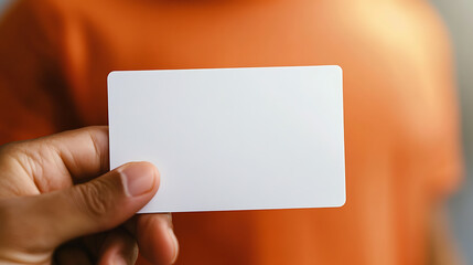 Close-up shot of a hand holding a blank white card, perfect for personalized messages. The minimalist design puts the focus on your text, offering endless possibilities and creativity.