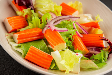 Crab sticks salad green salad leaves healthy food appetizer fresh gourmet food table setting rustic food top view copy space keto and paleo diet