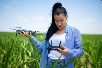 Woman farmer using drone for smart farming in corn field