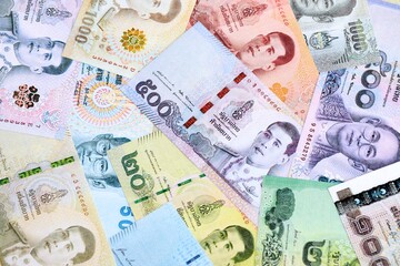 Thai baht currency money bills. The current banknotes lies on table in big amount close up