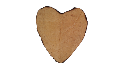 Vintage love symbol burnt aged paper heart on white background