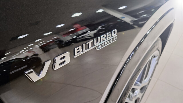 Russia, Moscow- 23 November 2025. Close-up of v8 biturbo 4matic emblem on black luxury car