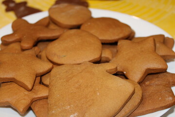 Baked cookies arranged on a plate for a festive celebration in a kitchen