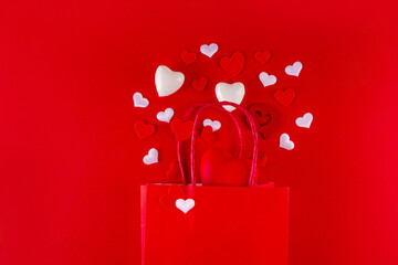 Valentine day sale and shopping background . Red paper shopping bag with text sale, white, red,...