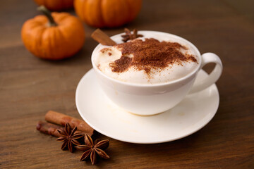 Pumpkin Spice Latte. A cozy pumpkin spice latte with cinnamon served in a white cup
