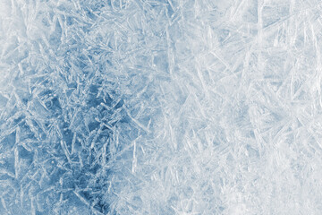Ice texture crystal, blue-toned background. Textured cold frosty surface of ice.
