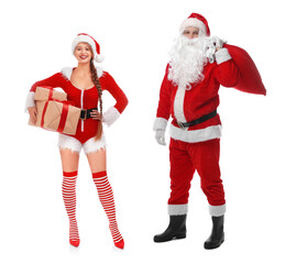 Man and woman in Santa costumes on white background. Merry Christmas and Happy winter holidays
