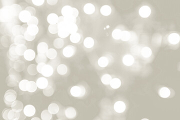 Abstract sparkling white light bokeh creating a soft, blurred background, perfect for celebrations...