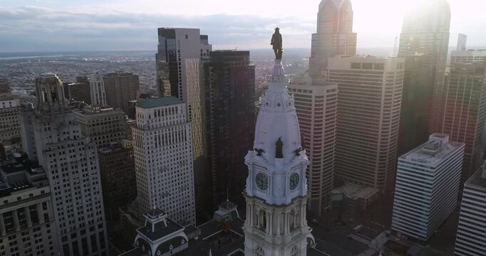 Statue of William Penn on Philadelphia City Hall Tower. Beautiful Cityscape. Business District and Downtown. Morning Sunlight. 4k