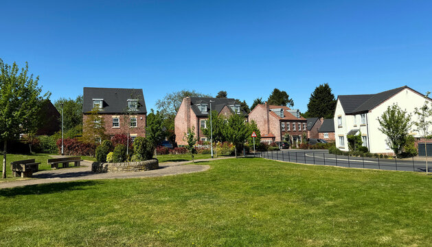 Between brick and leaf in Adel, the street holds its peace, Lawnswood Crescent beneath the generous sky of Leeds, UK