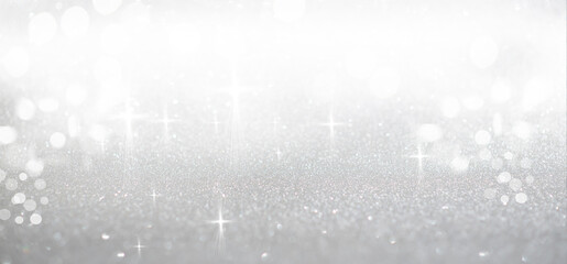 A collection of luxurious, deep emerald green glitter Christmas ornaments hanging against a background of sparkling gold glitter and warm bokeh lights. Holiday background, advertising visual.