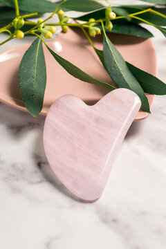 Rose quartz gua sha, abstract beauty photo