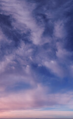 Calm Blue Sky With Wispy Clouds Across The Horizon For A Serene Cloudscape