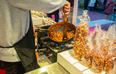 Caramelizing peanuts at the Christmas market