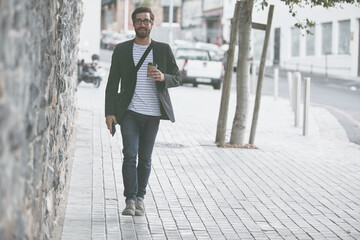 Walking, portrait and man with coffee in city for travel, morning commute and journey to work. Professional, happy and person with drink in urban town for career, business and trip to destination