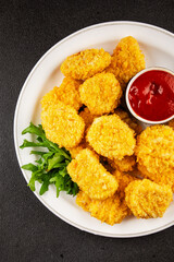 Chicken nuggets fast food natural tasty appetizer fresh delicious gourmet food background on the table rustic top view copy space