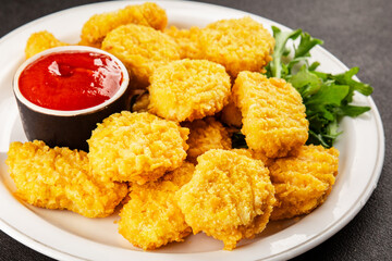 Chicken nuggets fast food natural tasty appetizer fresh delicious gourmet food background on the table rustic top view copy space
