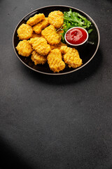 Chicken nuggets fast food natural tasty appetizer fresh delicious gourmet food background on the table rustic top view copy space