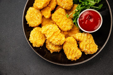 Chicken nuggets fast food natural tasty appetizer fresh delicious gourmet food background on the table rustic top view copy space