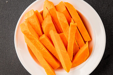 Raw sweet potato slices tasty snack fresh delicious gourmet food table background rustic top view copy space keto and paleo diet vegetarian and vegan food pescetarian diet