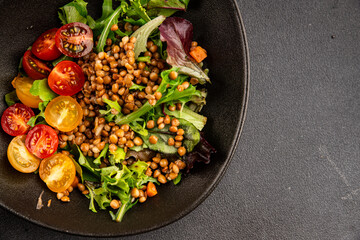 Lentil salad vegetables, tomato, green leaf lettuce tasty snack fresh delicious gourmet food table setting rustic top view copy space keto and paleo diet vegetarian and vegan food