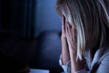 Senior woman experiencing stress and mental health problems