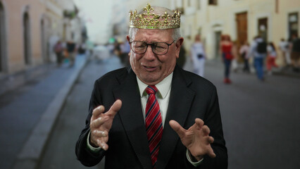 Senior man in suit with crown looks distressed on bustling urban street, creating a striking...