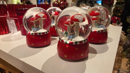 Festive Christmas snow globes with reindeer and mushrooms