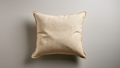 studio product photo of a beige decorative cushion isolated on neutral background