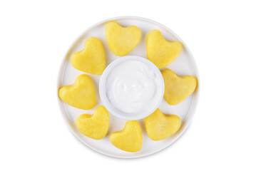 Potato gnocchi in the form of hearts with cream sauce for Valentine's day holidays on a white isolated background