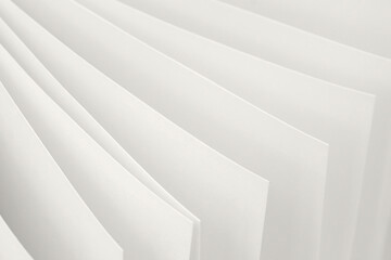 Soft overlapping sheets of white paper create clean, airy visual in the delicate hue of Cloud Dancer, color of the year 2026. Concept of purity, minimalism. Natural backdrop for design