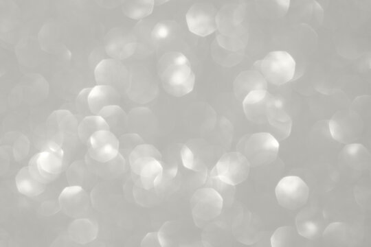 Soft gray bokeh background with circular light patterns, abstract and serene Demonstration Color of the Year 2026.