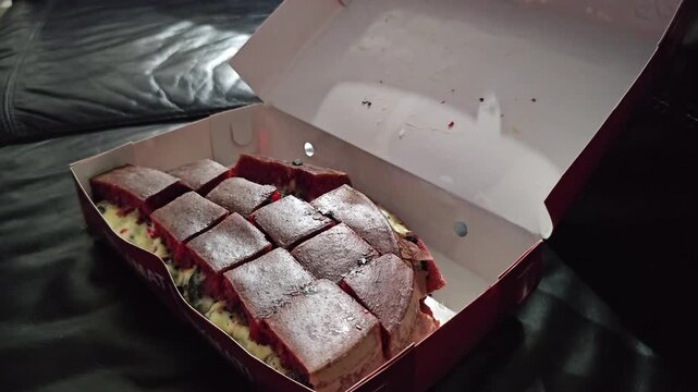 baking in the ovenMartabak manis red velvet with black cookies and cheese filling.Sweet Indonesian pancake filled with black cookies and cheese.Sweet red velvet martabak,Terang bulan 