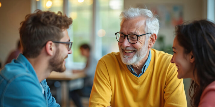 Smiling senior man interacts with diverse younger generation. People share ideas, laugh together in casual setting. Multi-ethnic group enjoys conversation, positive meeting. Seniors mentoring youths, - Powered by Adobe