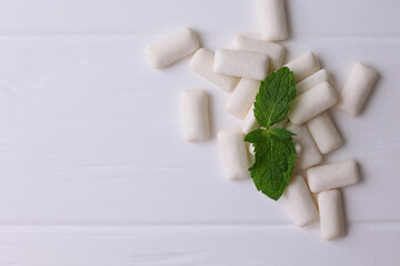 mint chewing gum and mint on the table. Fresh breath, oral care 