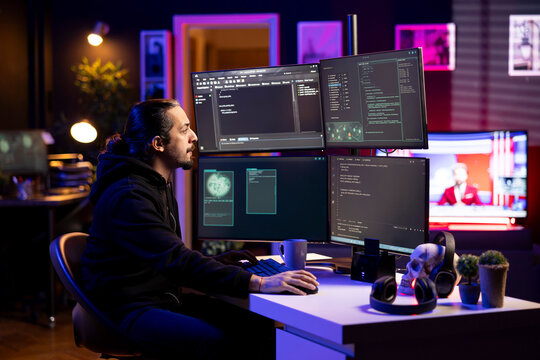 Hacker in secret hideout using ransomware attacks to hold company systems hostage and demand large payments. Rogue software developer hacking enterprise networks, encrypting files - Powered by Adobe