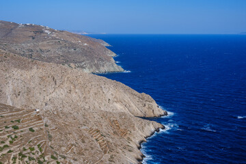 Folegandros coast, contrasting cliff and deep blue sea