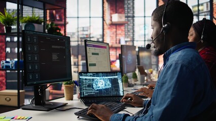 Call center employee using artificial intelligence chatbot to provide multilingual support to customers. Customer support operator leveraging AI tools to translate clients interactions, camera B