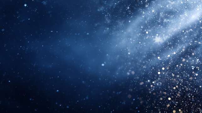 Blue winter snowfall background with glittering bokeh for festive designs