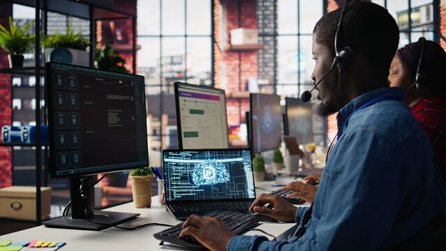 Call center employee using artificial intelligence chatbot to provide multilingual support to customers. Customer support operator leveraging AI tools to translate clients interactions, camera B