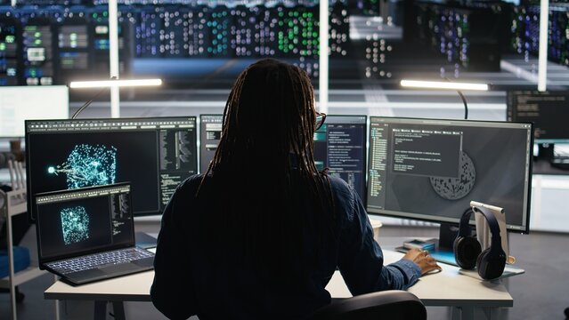 Data center system administrator using node tree software to analyze datasets. Server room IT professional using visual programming tools to improve infrastructure performance, camera A