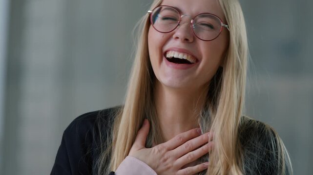 Portrait happy laughing Caucasian business woman laugh in office looking at camera positive joyful businesswoman girl female entrepreneur specialist worker fun smiling humorous joke reaction funny