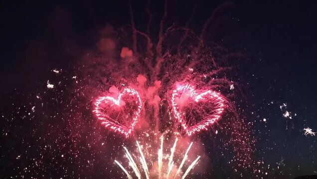 Heart shaped fireworks display celebration love and romance pyrotechnics show in night sky festival event