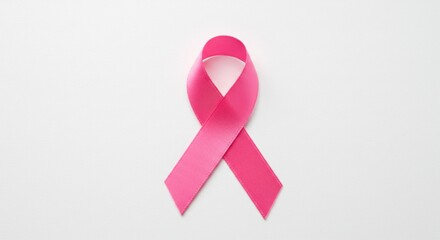 Pink ribbon on white background, symbol of breast cancer awareness month campaign