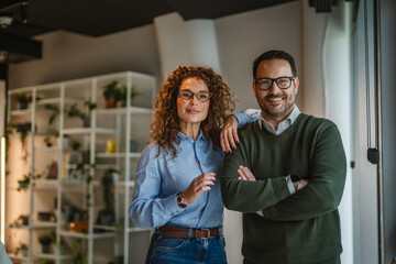 Business partners smiling together in modern office