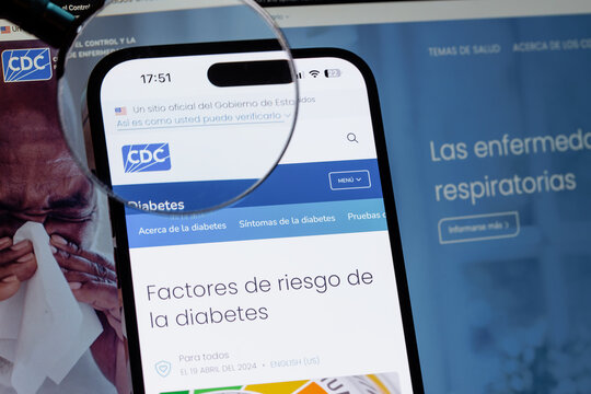 USINSK, Russian FEDERATION - December 04, 2025: Smartphone displays the website of the Center for Diabetes Control and Prevention with a magnifying glass, emphasizing the importance of medical informa