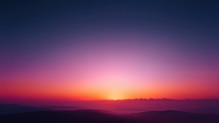 Fototapeta premium Breathtaking sunset over rolling hills with vibrant hues of purple, pink, and orange illuminating the sky and creating a serene landscape scene