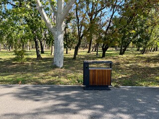 Park Trash Can Beside Tree Lined Path
